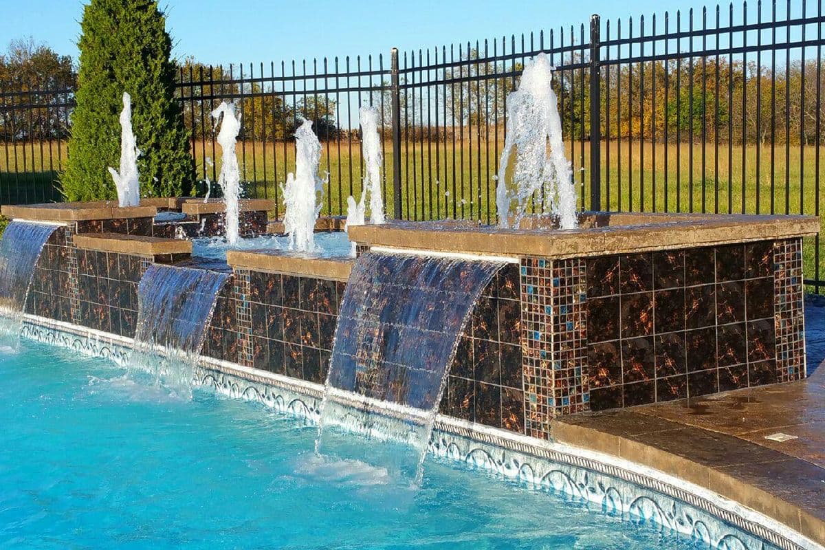 Waterfall feature at edge of pool.